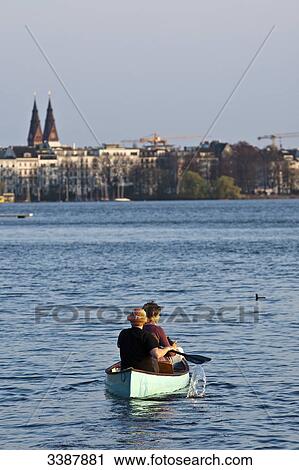 Two people in a canoe on the Aussenalster, Hamburg, Germany, rear view View Large Photo Image Stock Image - Two people in a canoe on the Aussenalster, Hamburg, Germany, rear view . Fotosearch