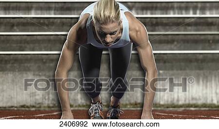 Woman on starting blocks View Large Photo Image Stock Image - Woman on starting blocks . Fotosearch