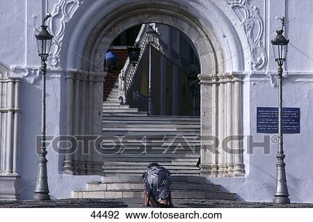 Woman praying on staircase of church, Tinos, Cyclades Islands, Greece View Large Photo Image Stock Image - Woman praying on staircase of church, Tinos, Cyclades Islands, Greece . Fotosearch