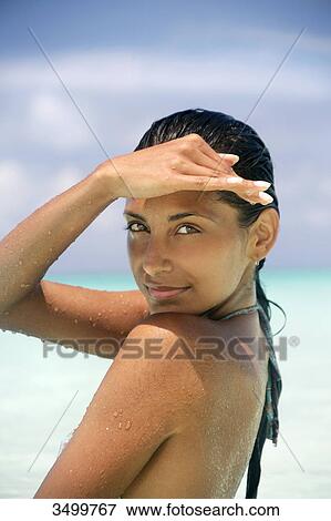 Woman shading eyes with her hand, portrait View Large Photo Image Stock Photo - Woman shading eyes with her hand, portrait . Fotosearch