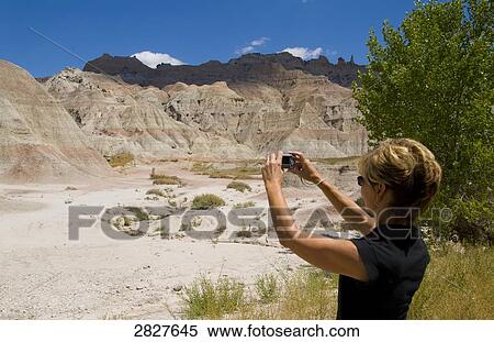 Woman taking pictures with her camera, South Dakota, USA  View Large Photo Image Stock Photography - Woman taking pictures with her camera, South Dakota, USA . Fotosearch