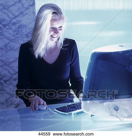 Stock Photo - Woman using computer . Fotosearch