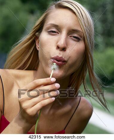 Woman with dandelion, portrait View Large Photo Image Stock Photography - Woman with dandelion, portrait . Fotosearch
