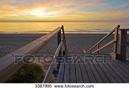 Wooden staircase at North Sea coast, Sylt, Germany View Large Photo Image Stock Photography - Wooden staircase at North Sea coast, Sylt, Germany . Fotosearch