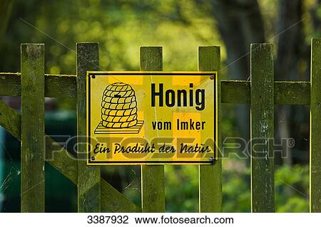 Yellow sign on a wooden fence, close-up View Large Photo Image Stock Image - Yellow sign on a wooden fence, close-up . Fotosearch