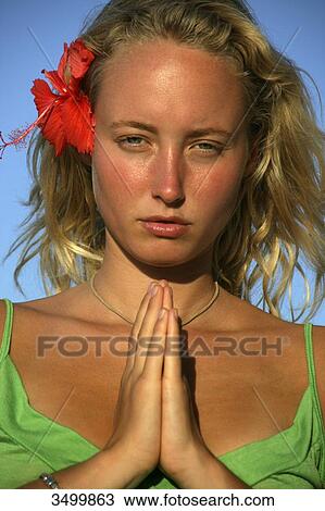 Young woman folding hands, portrait View Large Photo Image Stock Image - Young woman folding hands, portrait . Fotosearch
