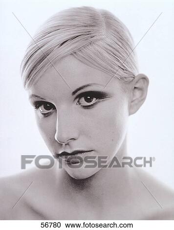 Young woman looking at camera, portrait View Large Photo Image Stock Image - Young woman looking at camera, portrait . Fotosearch