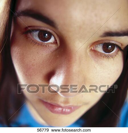 Stock Photo - Young woman looking sad, close-up . Fotosearch