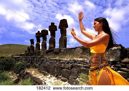 Young woman standing in field with statues in row, Moai Statue, Easter Island, Chile View Large Photo Image Stock Image - Young woman standing in field with statues in row, Moai Statue, Easter Island, Chile . Fotosearch