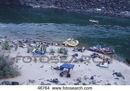 Picture - Aerial view of inflatable boats and people at riverside, Colorado River, Arizona, USA . Fotosearch