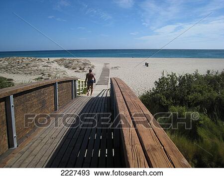 Boardwalk leading towards beach, Posada, Sardinia, Italy View Large Photo Image Stock Image - Boardwalk leading towards beach, Posada, Sardinia, Italy . Fotosearch