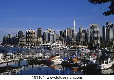 Boats at port with skyscrapers in background, Port Of Vancouver, Vancouver, Canada View Large Photo Image Picture - Boats at port with skyscrapers in background, Port Of Vancouver, Vancouver, Canada . Fotosearch