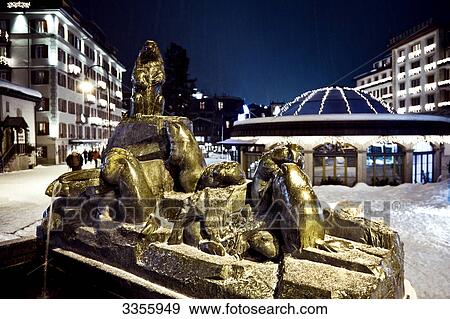 Stock Photo - Bronze sculptures on a fountain, Zermatt, Switzerland, close-up . Fotosearch