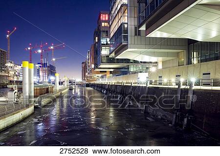 Buildings in city lit up at night, Germany View Large Photo Image Stock Photo - Buildings in city lit up at night, Germany . Fotosearch