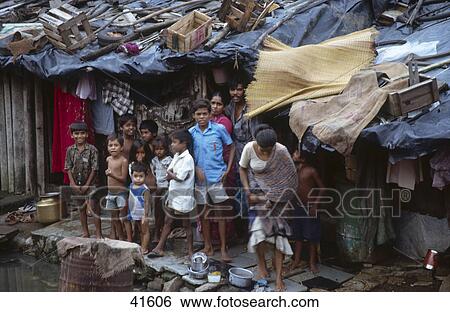 Children standing in front of their house, Bombay View Large Photo Image Stock Photograph - Children standing in front of their house, Bombay . Fotosearch