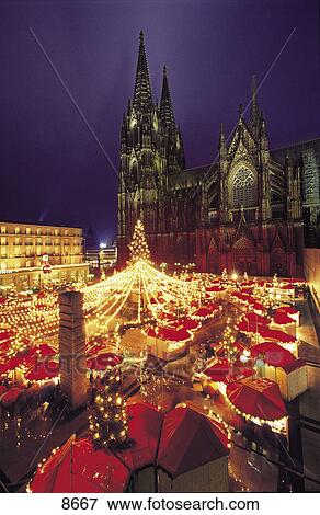 Stock Photo - Christmas fair in front of cathedral, Cologne, Germany . Fotosearch