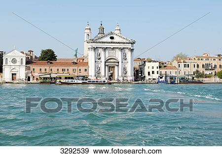 Stock Photo - Church at the waterfront of a canal, Venice, Italy . Fotosearch