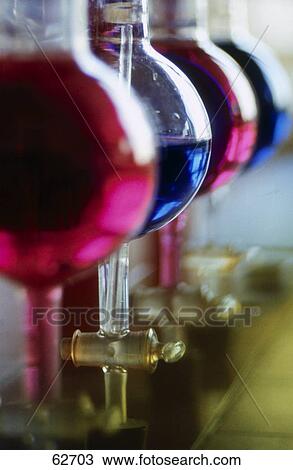 Close-up of flasks in row View Large Photo Image Stock Image - Close-up of flasks in row . Fotosearch