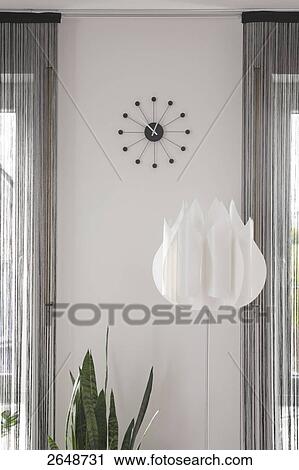 Close-up of floor lamp and clock on wall View Large Photo Image Stock Image - Close-up of floor lamp and clock on wall . Fotosearch