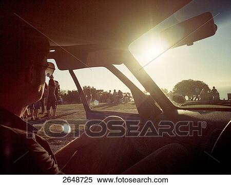 Close-up of man sitting in car, South Africa View Large Photo Image Stock Photography - Close-up of man sitting in car, South Africa . Fotosearch