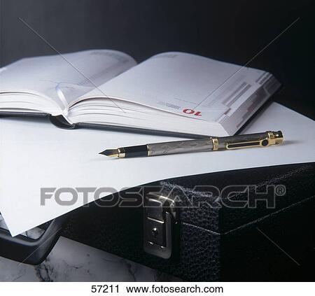 Close-up of pen with paper and diary on briefcase View Large Photo Image Stock Image - Close-up of pen with paper and diary on briefcase . Fotosearch
