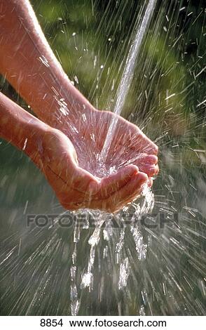 Picture - Close-up of person washing hands . Fotosearch