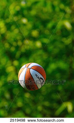 Stock Photo - Close-up of soccer ball in air . Fotosearch