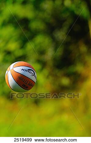 Stock Photo - Close-up of soccer ball in air . Fotosearch