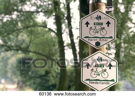 Close-up of two signboards on wooden post, Emsland, Lower Saxony, Germany View Large Photo Image Stock Photograph - Close-up of two signboards on wooden post, Emsland, Lower Saxony, Germany . Fotosearch