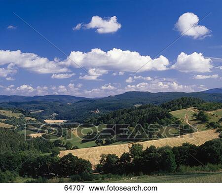 Stock Photo - Clouds in sky above rural landscape, Ludwigstein Castle, Witzenhausen, Werra Valley, Hesse, Germany . Fotosearch