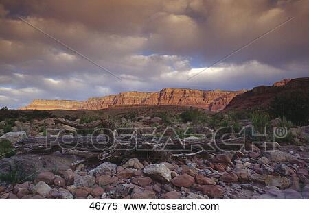 Stock Photography - Clouds over rocky landscape, Arizona, USA . Fotosearch