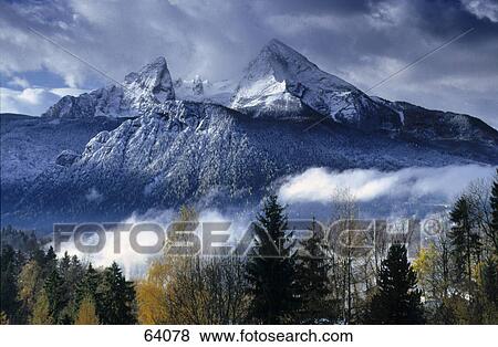 Clouds over snowcapped mountains, Watzmann, Berchtesgaden, Germany View Large Photo Image Stock Photo - Clouds over snowcapped mountains, Watzmann, Berchtesgaden, Germany . Fotosearch