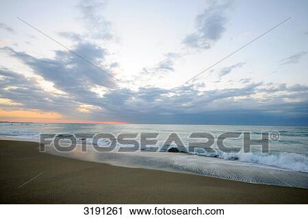 Dawn over beach, Catalonia, Spain, horizontal format  View Large Photo Image Stock Image - Dawn over beach, Catalonia, Spain, horizontal format . Fotosearch