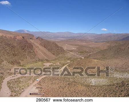 Dirt road passing through valley, Salta, Argentina View Large Photo Image Stock Photo - Dirt road passing through valley, Salta, Argentina . Fotosearch