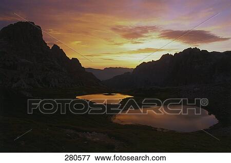 Elevated view on Sexten Dolomites and lakes at sunset, South Tyrol, Italy View Large Photo Image Stock Photo - Elevated view on Sexten Dolomites and lakes at sunset, South Tyrol, Italy . Fotosearch