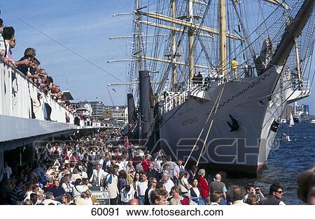 Group of people at harbor near ship, Hamburg, Germany View Large Photo Image Stock Image - Group of people at harbor near ship, Hamburg, Germany . Fotosearch