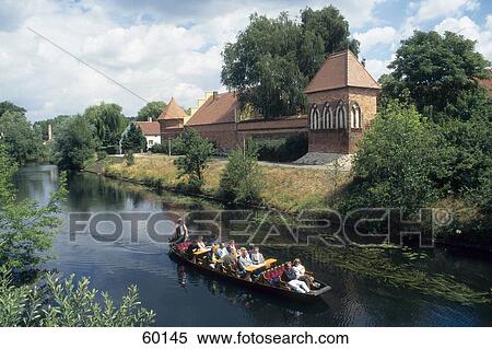 Stock Photography - Group of people rowing boat, Lubben, Lower Lusatia, Brandenburg, Germany . Fotosearch