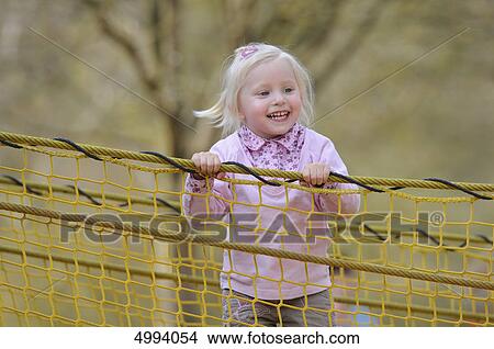 Happy girl on the playground View Large Photo Image Picture - Happy girl on the playground . Fotosearch