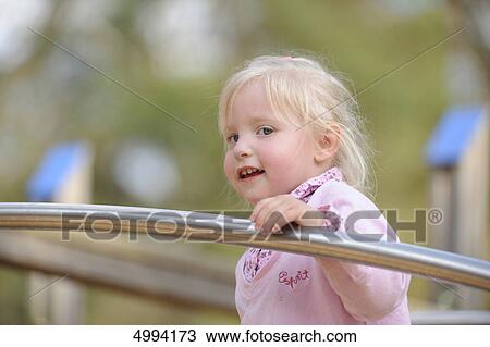 Happy girl on the playground View Large Photo Image Stock Image - Happy girl on the playground . Fotosearch
