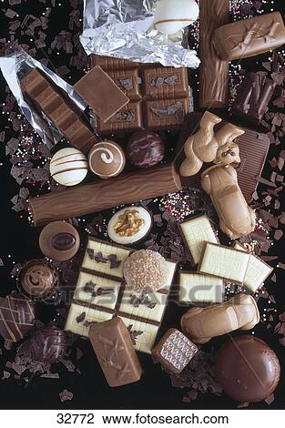 Stock Image - High angle view of assorted praline chocolates . Fotosearch