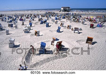 Stock Photography - High angle view of beach chairs on sand . Fotosearch