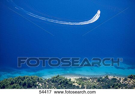 Stock Photo - High angle view of boat in sea, Makarska Riviera, Croatia . Fotosearch