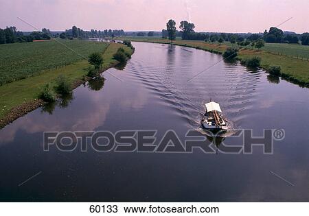 Stock Image - High angle view of motorboat in river, Lower Saxony, Germany, Europe . Fotosearch