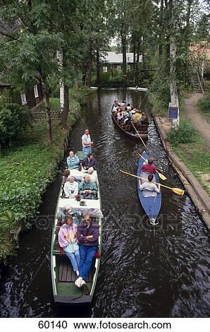 Stock Image - High angle view of tourists on boats in canal, Spreewald, Lehde, Brandenburg, Germany . Fotosearch