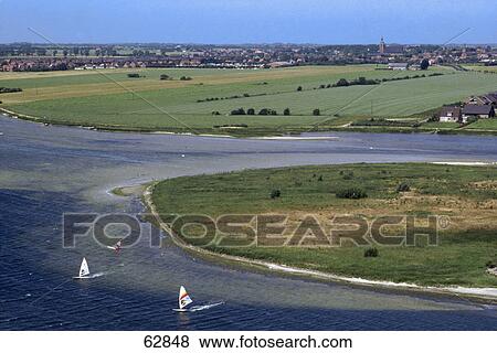 Stock Photo - High angle view of windsurfing boards in sea, Schleswig-Holstein, Germany, Europe . Fotosearch