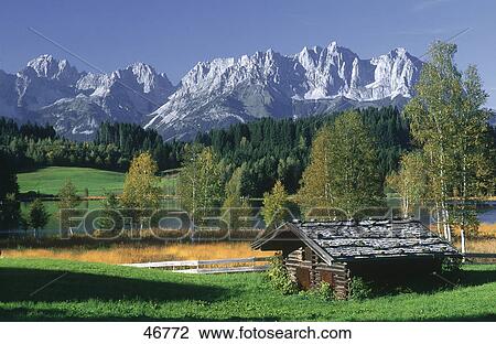 Stock Image - Hut with lake in background, Lake Schwarzsee, Wilder Kaiser, Austria . Fotosearch