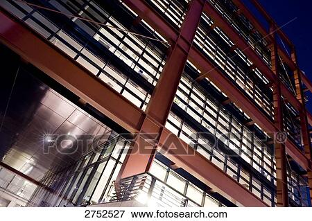 Stock Photo - Low angle view of building lit up at night . Fotosearch