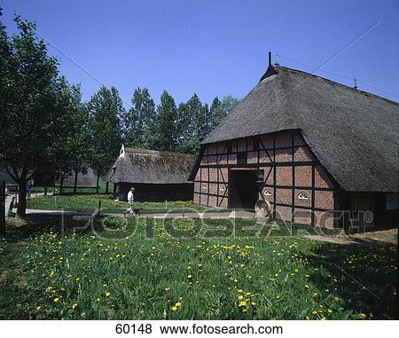 Man with dog at open air museum, Molfsee, Germany View Large Photo Image Stock Photo - Man with dog at open air museum, Molfsee, Germany . Fotosearch