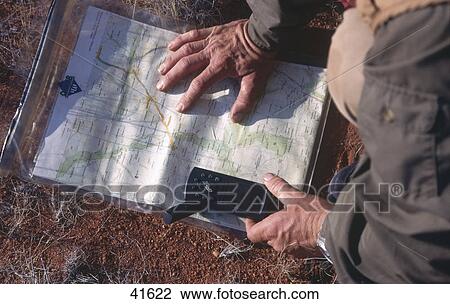Mid section view of man with map and GPS, Australia View Large Photo Image Stock Image - Mid section view of man with map and GPS, Australia . Fotosearch