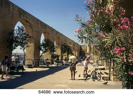 Stock Photograph - People in garden, Upper Barracca Gardens, Valette, Malta . Fotosearch